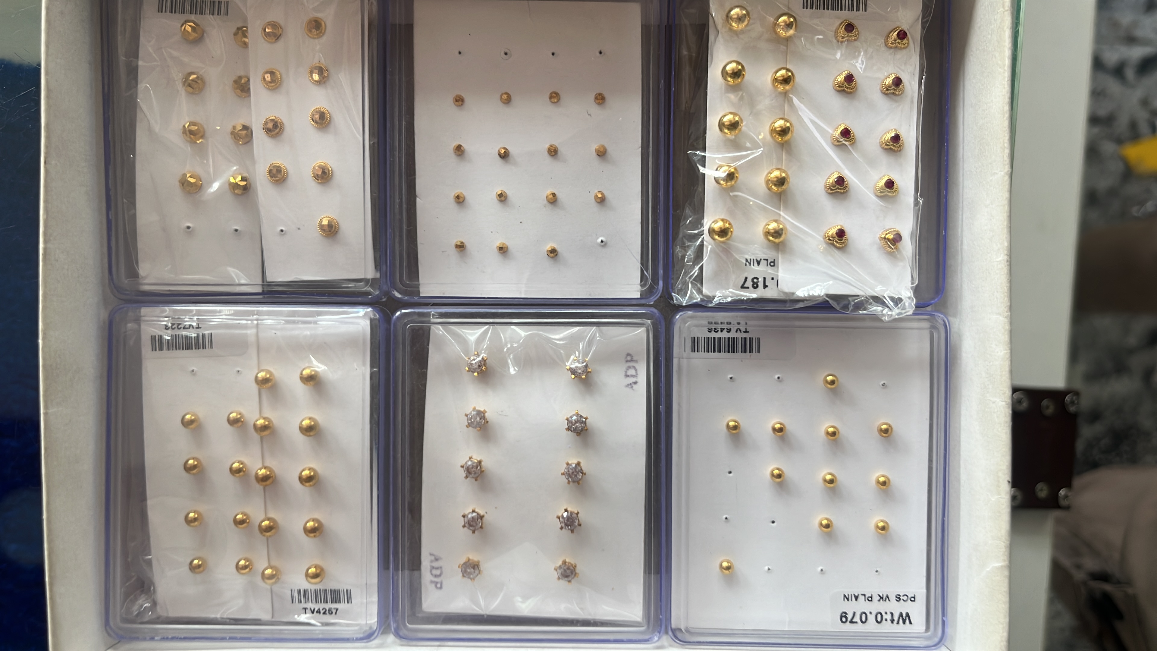 Nose pins and gold earrings two win