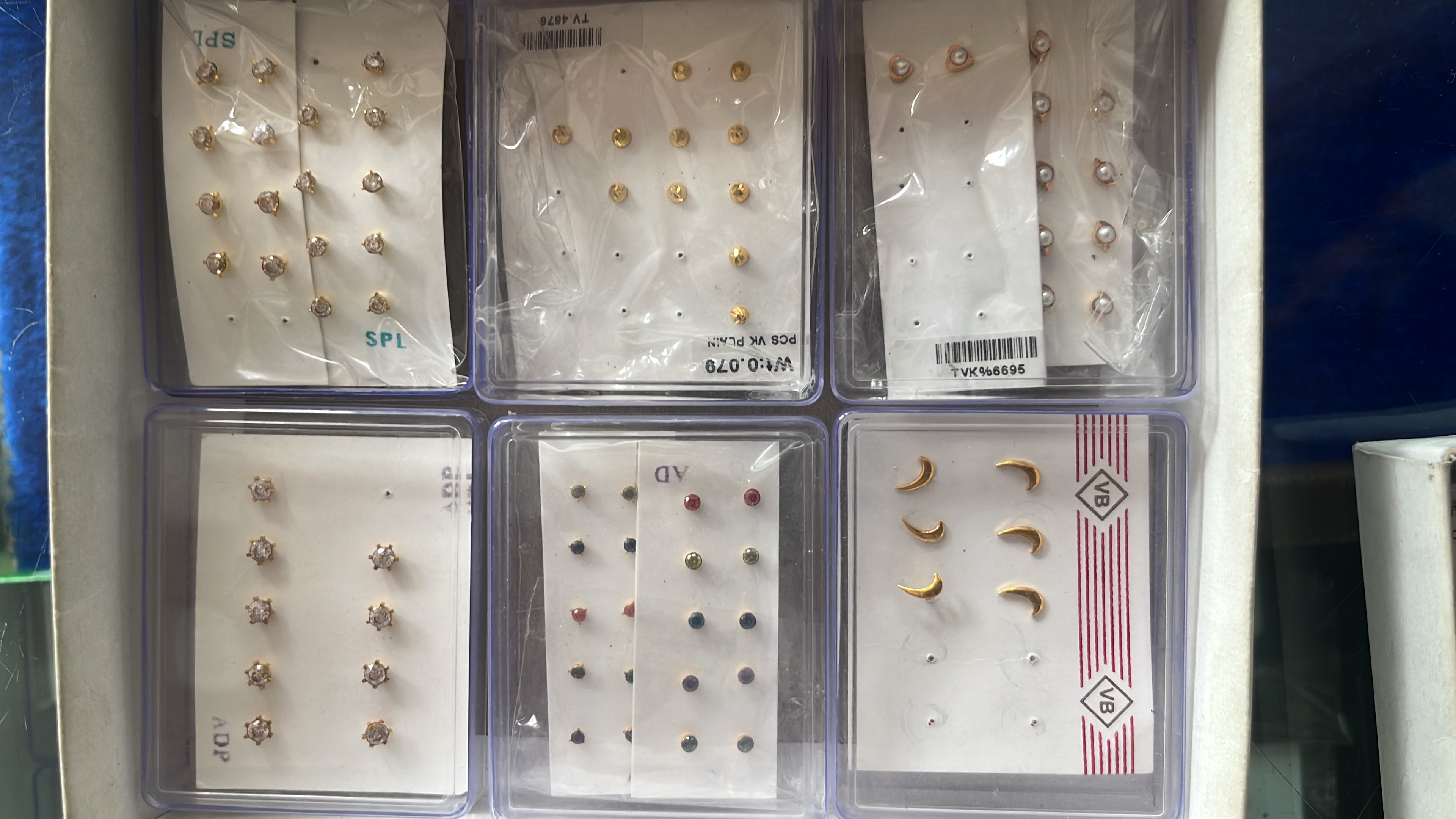 Nose pins and gold earrings two win