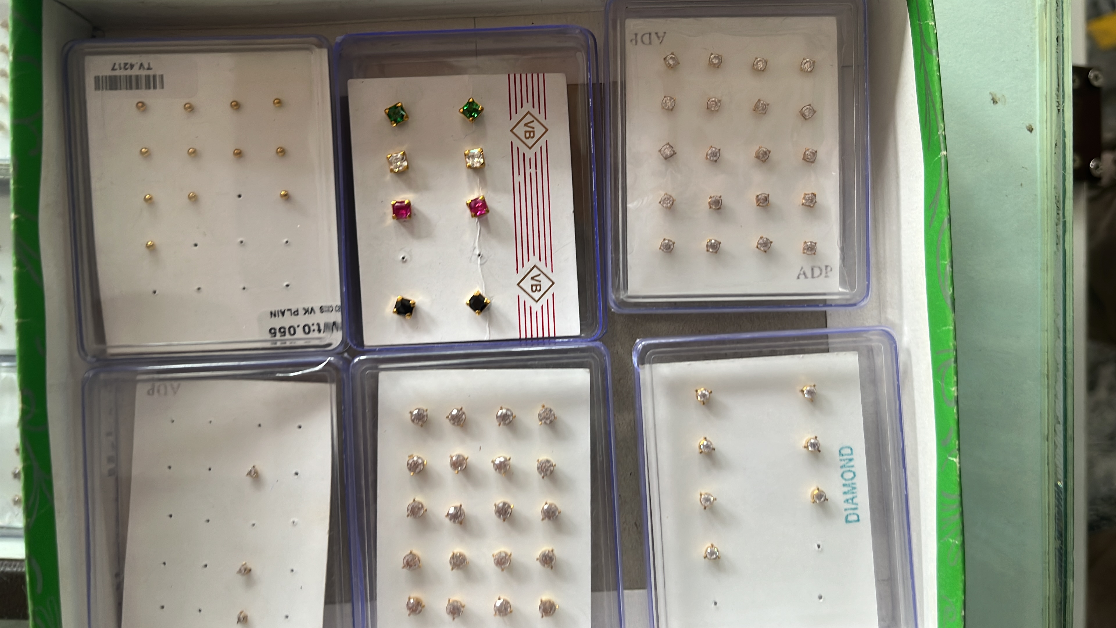 Nose pins and gold earrings two win